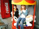 Emily & Payton on a merry-go-round
