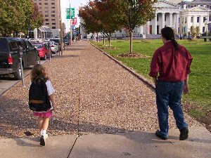 Cal and Emily (carrying my heavy backpack), walking towards the courthouse.