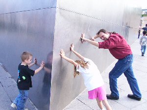 Cal and the kids, attempting to commit a terrorist act by toppling the arch over.  They fail.