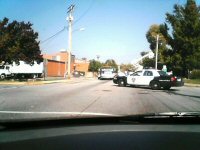 I drive to the post office only to find the whole street blocked off by cops.