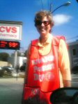 A lady approaches my car and asks for a donation.  She's happy to let me take her picture.