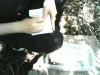 tricia signing a geocache logbook