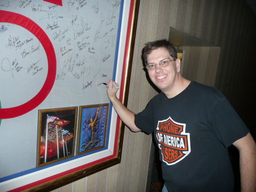 Signing the Olympic poster